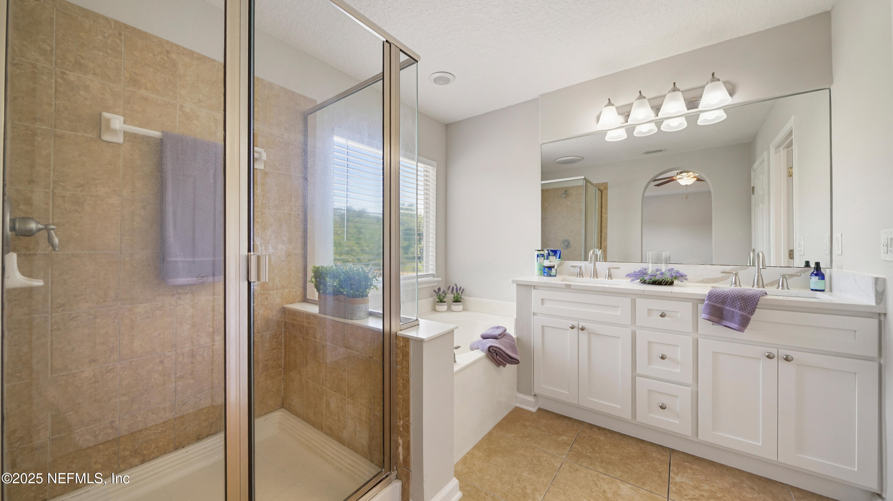 18 Amistad Drive St. Augustine, FL 32086 - Photo 17 of 36 a spacious bathroom with a double vanity sink a mirror and a shower