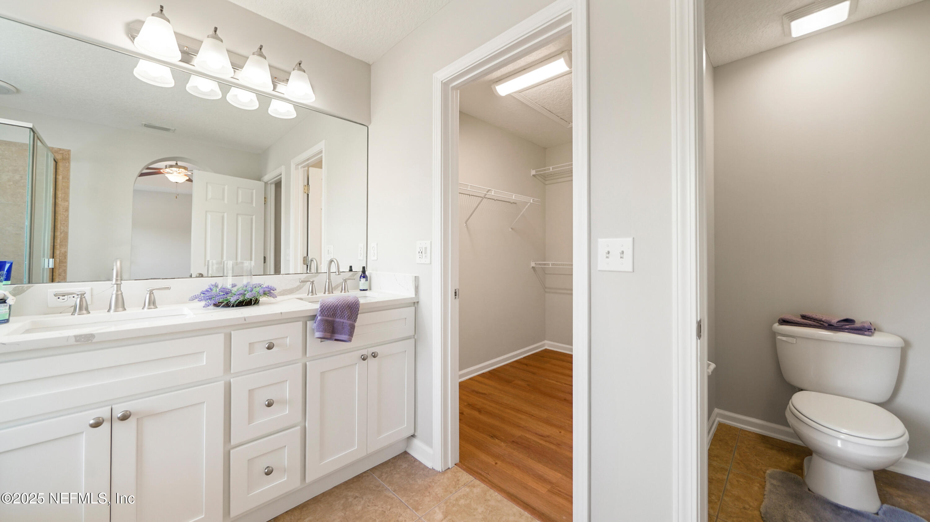18 Amistad Drive St. Augustine, FL 32086 - Photo 18 of 36 a bathroom with a sink a toilet and a large mirror