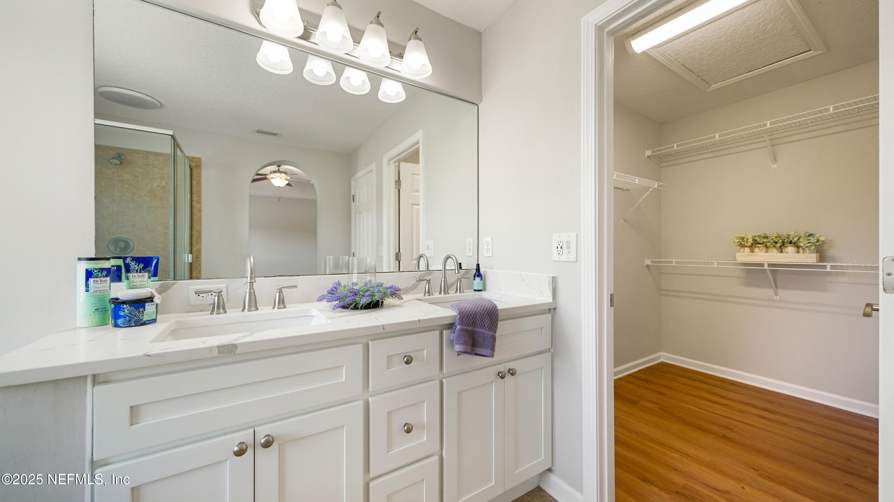 18 Amistad Drive St. Augustine, FL 32086 - Photo 19 of 36 a bathroom with a double vanity sink and a mirror