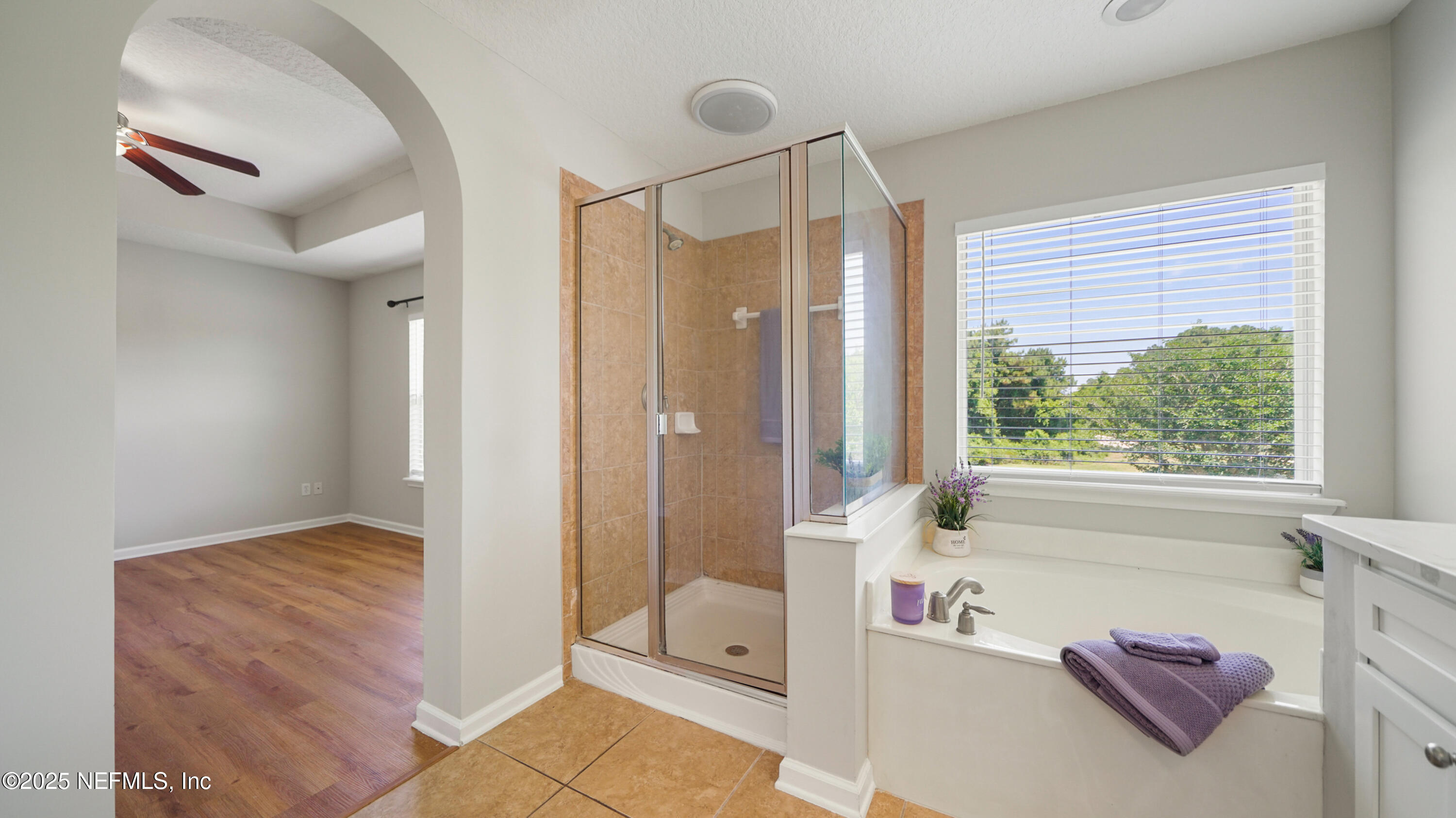 18 Amistad Drive St. Augustine, FL 32086 - Photo 20 of 36 a spacious bathroom with a tub shower and windows