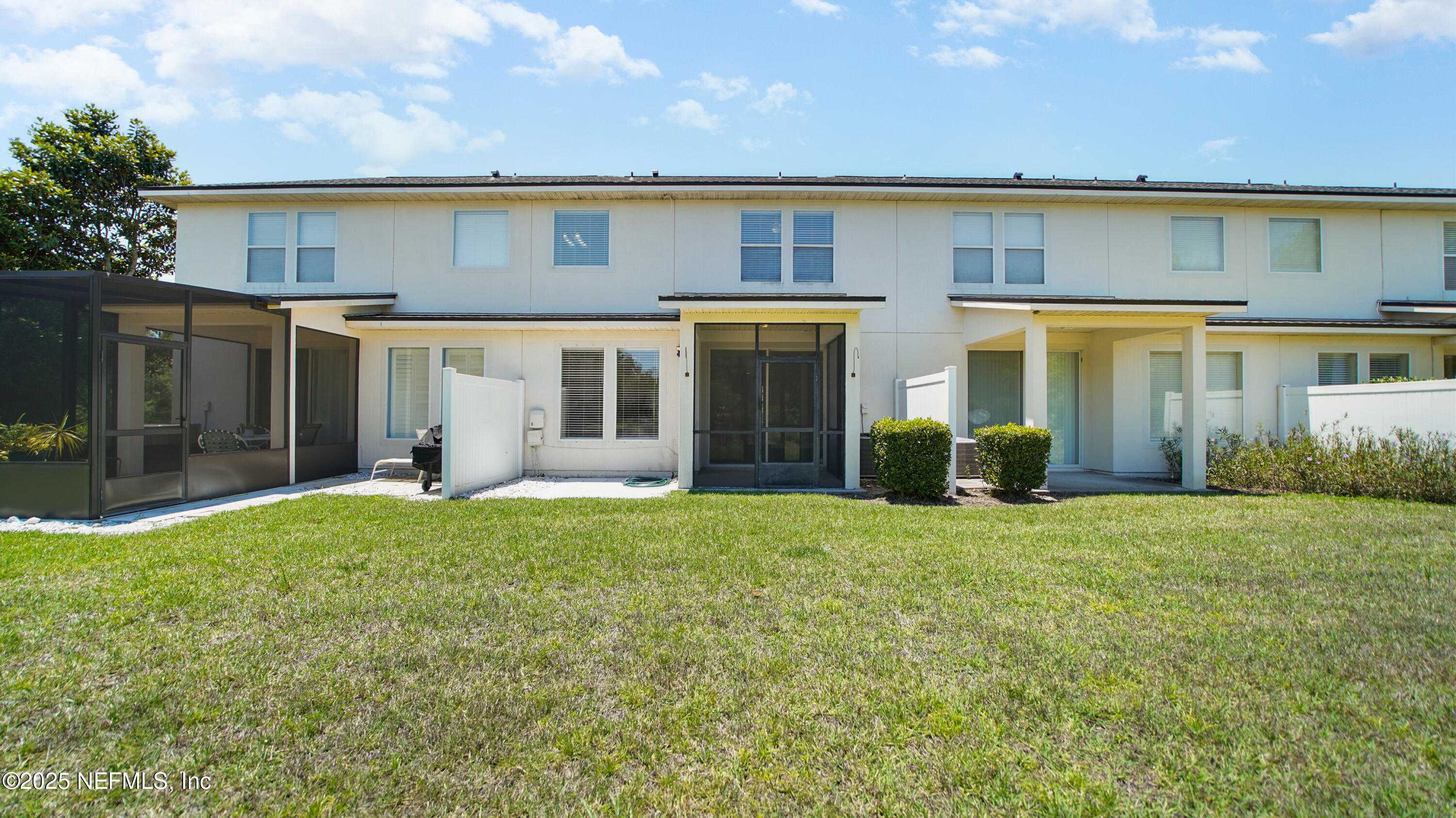 18 Amistad Drive St. Augustine, FL 32086 - Photo 30 of 36 front view of a building with a yard