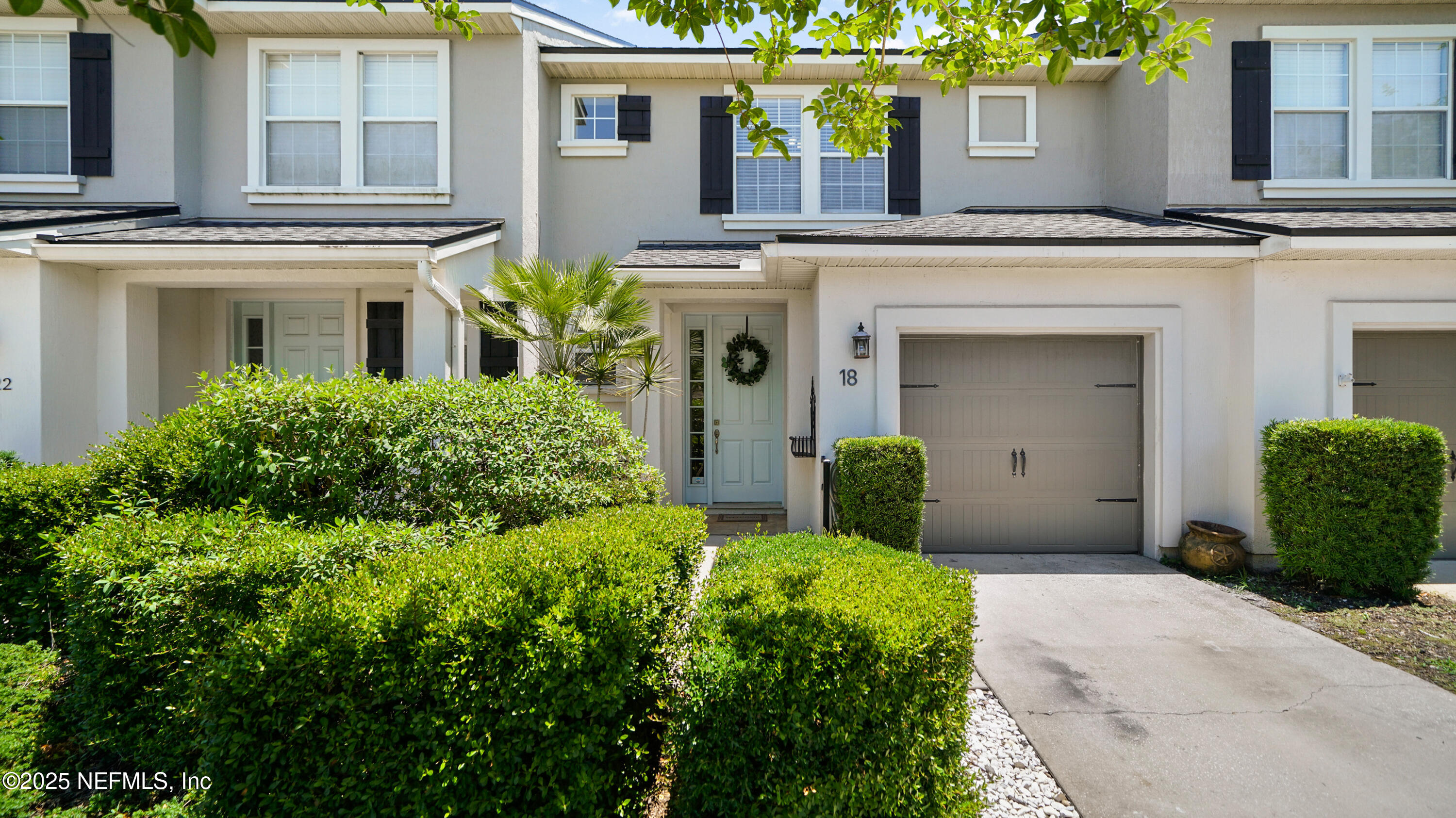18 Amistad Drive St. Augustine, FL 32086 - Photo 32 of 36 a front view of a house with garden