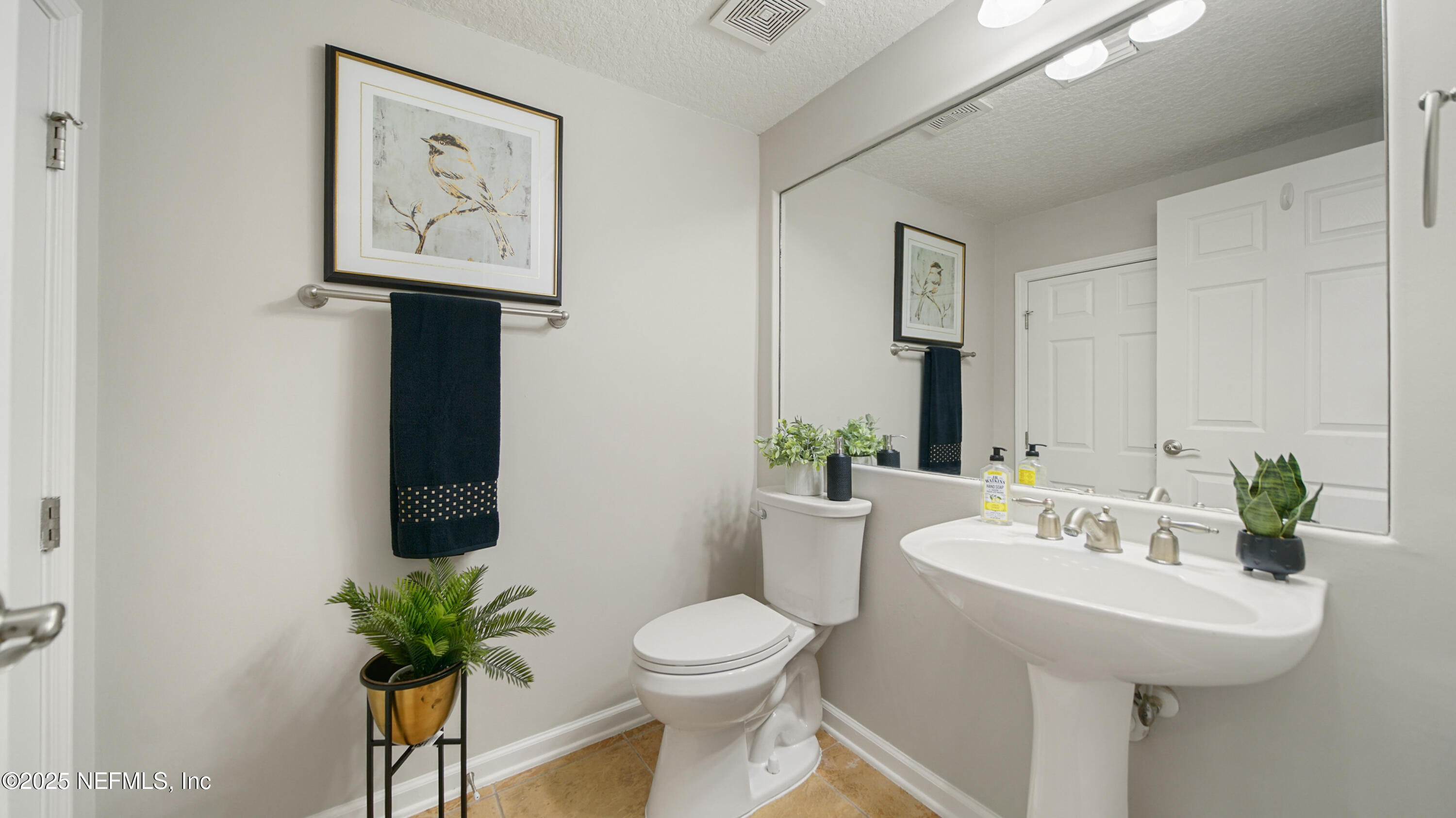 18 Amistad Drive St. Augustine, FL 32086 - Photo 4 of 36 a bathroom with a that has toilet sink and mirror