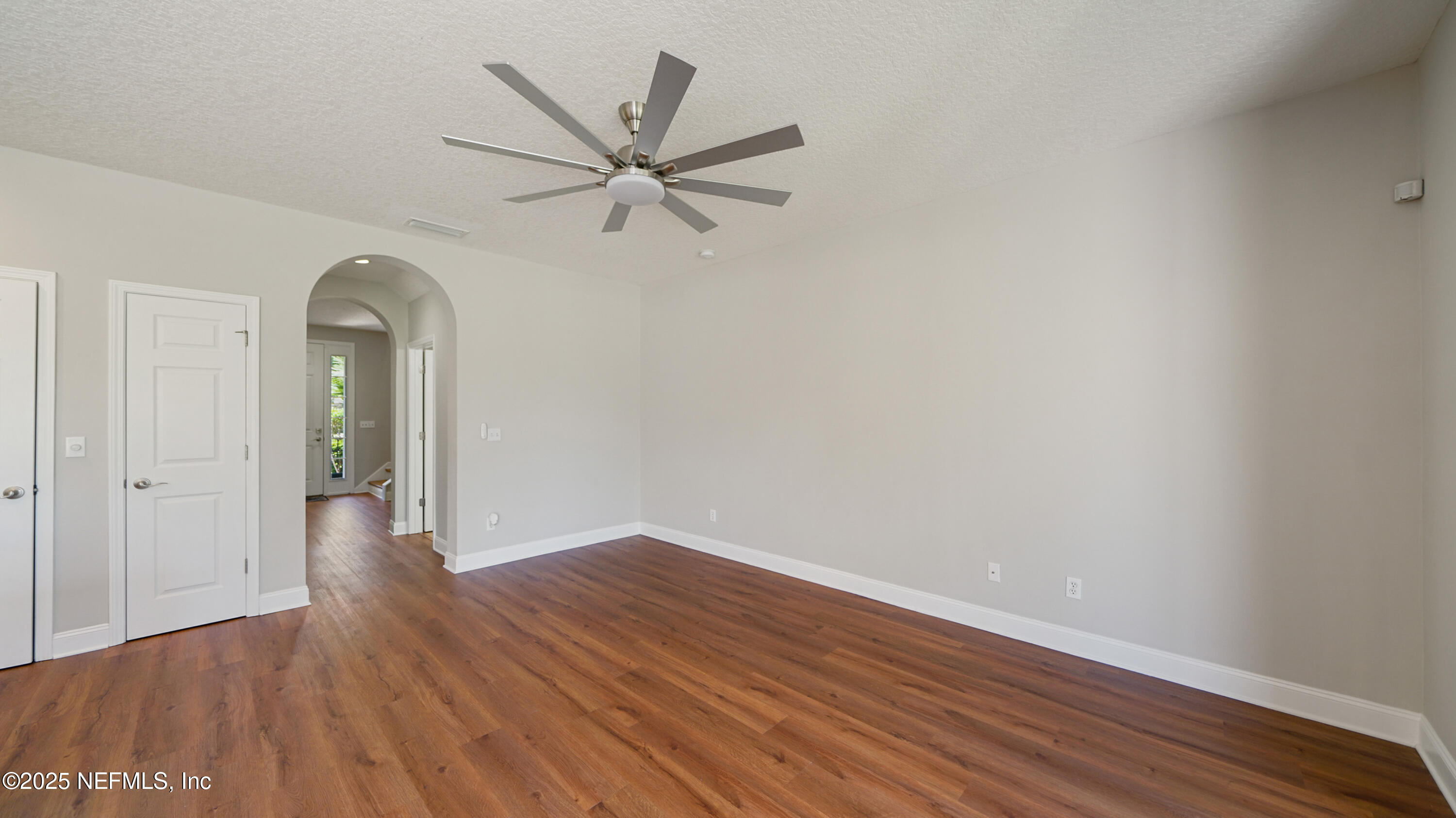 18 Amistad Drive St. Augustine, FL 32086 - Photo 10 of 36 a view of a livingroom with wooden floor and a ceiling fan