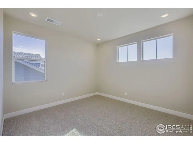 a bedroom with a bed and a walk in closet
