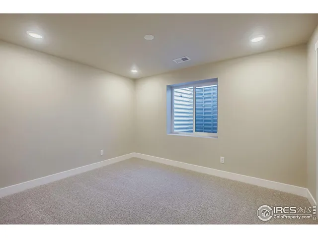 a bathroom with a granite countertop sink toilet and a mirror