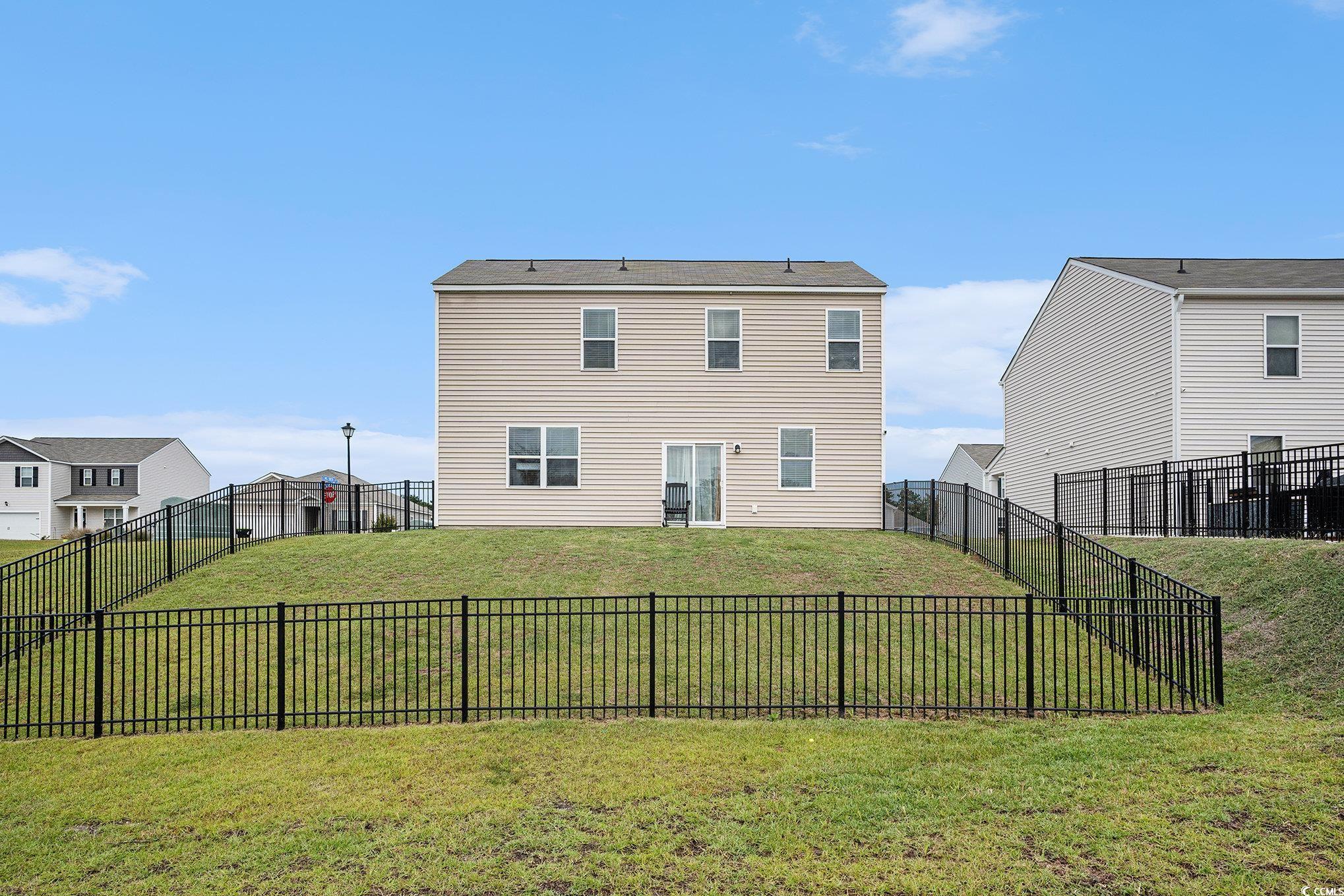 1178 Sennema Circle Myrtle Beach, SC 29588 - Photo 25 of 31 Back of property featuring a fenced backyard