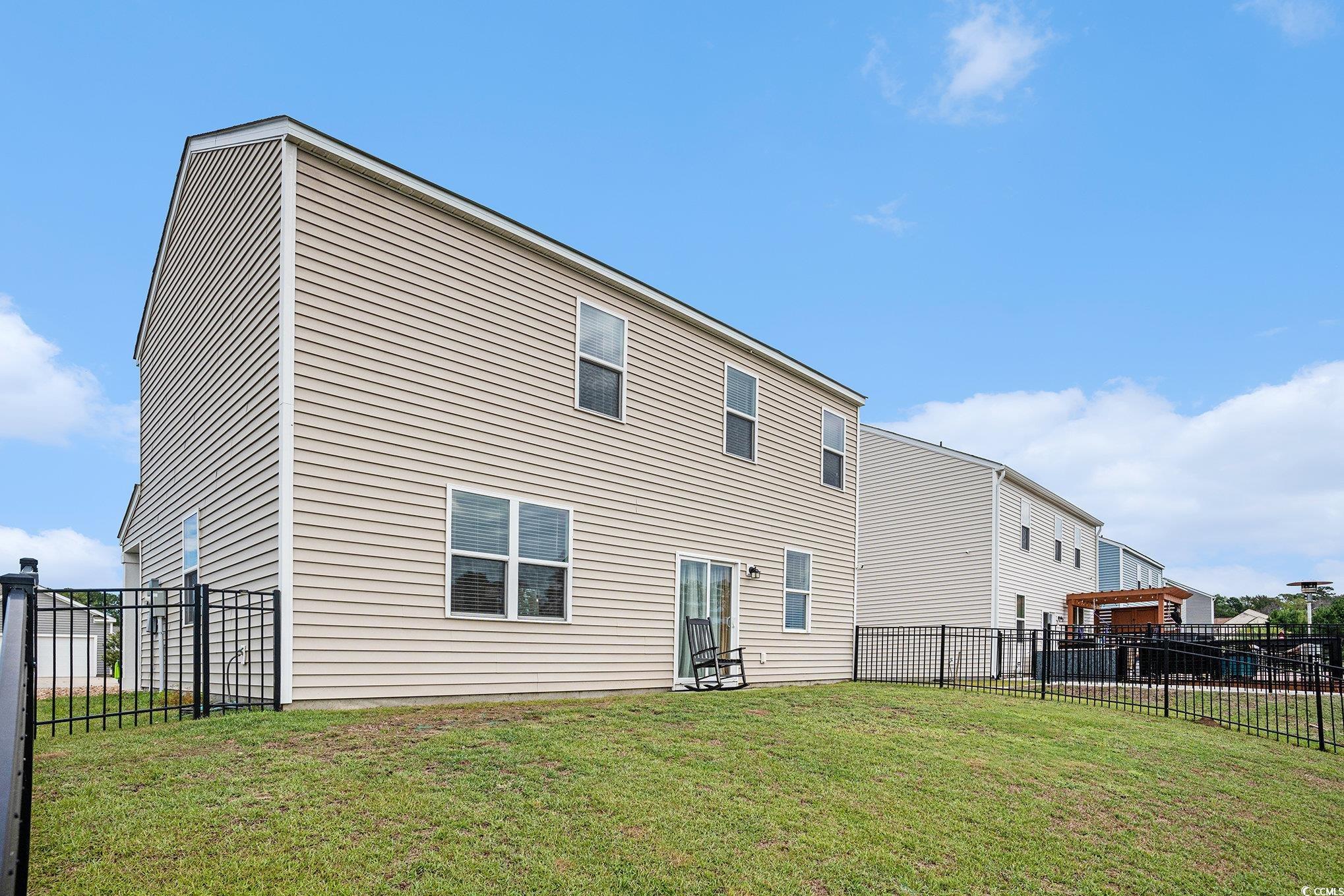 1178 Sennema Circle Myrtle Beach, SC 29588 - Photo 26 of 31 Rear view of property featuring a fenced backyard
