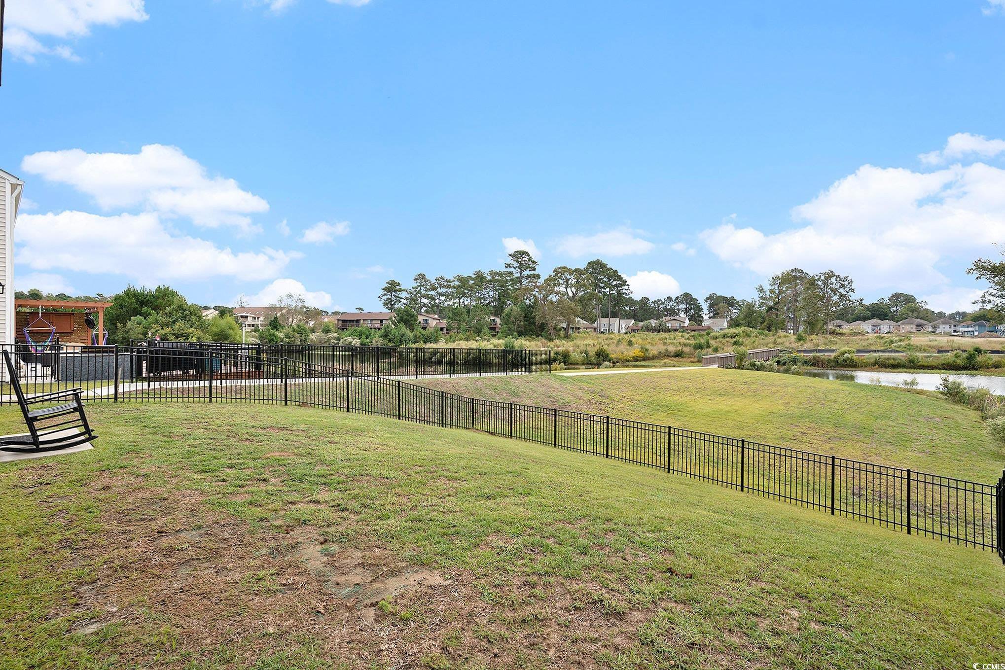1178 Sennema Circle Myrtle Beach, SC 29588 - Photo 27 of 31 Fenced backyard with a water view
