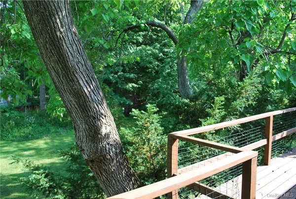 a view of balcony with wooden floor and outdoor space