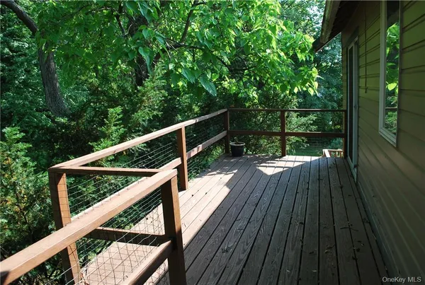 a bathroom with a sink a mirror and a shower