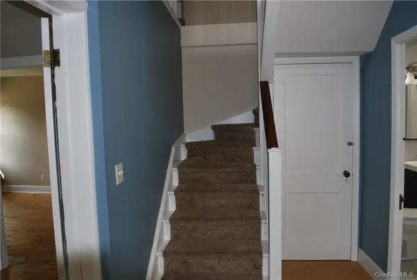 a view of a livingroom with a staircase