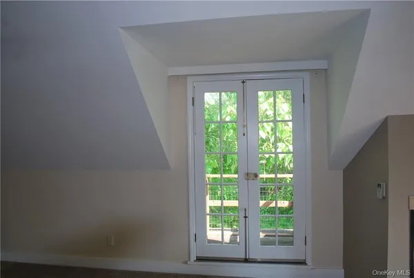 a view of a house with a tree