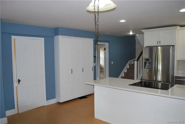 a view of a livingroom with a staircase