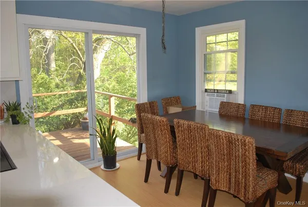 a view of a dining room with furniture window and outside view