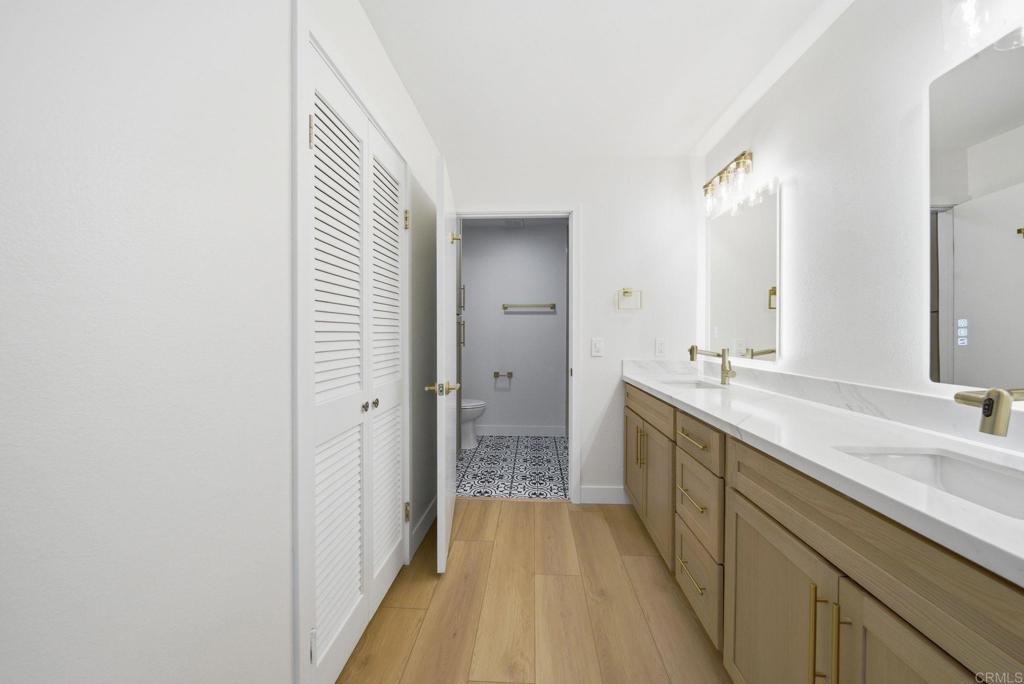 6757 Friars Road, Unit 36 San Diego, CA 92108 - Photo 2 of 23 a spacious bathroom with a double vanity sink and mirror