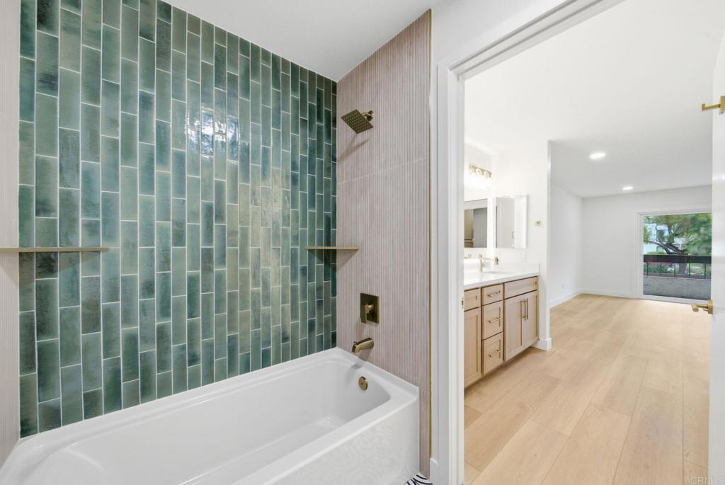 6757 Friars Road, Unit 36 San Diego, CA 92108 - Photo 3 of 23 a bathroom with a bathtub and a shower