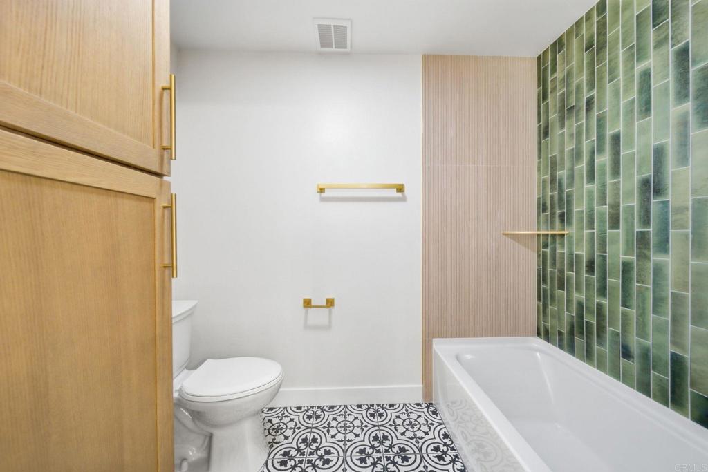 6757 Friars Road, Unit 36 San Diego, CA 92108 - Photo 4 of 23 a bathroom with a sink a toilet and shower