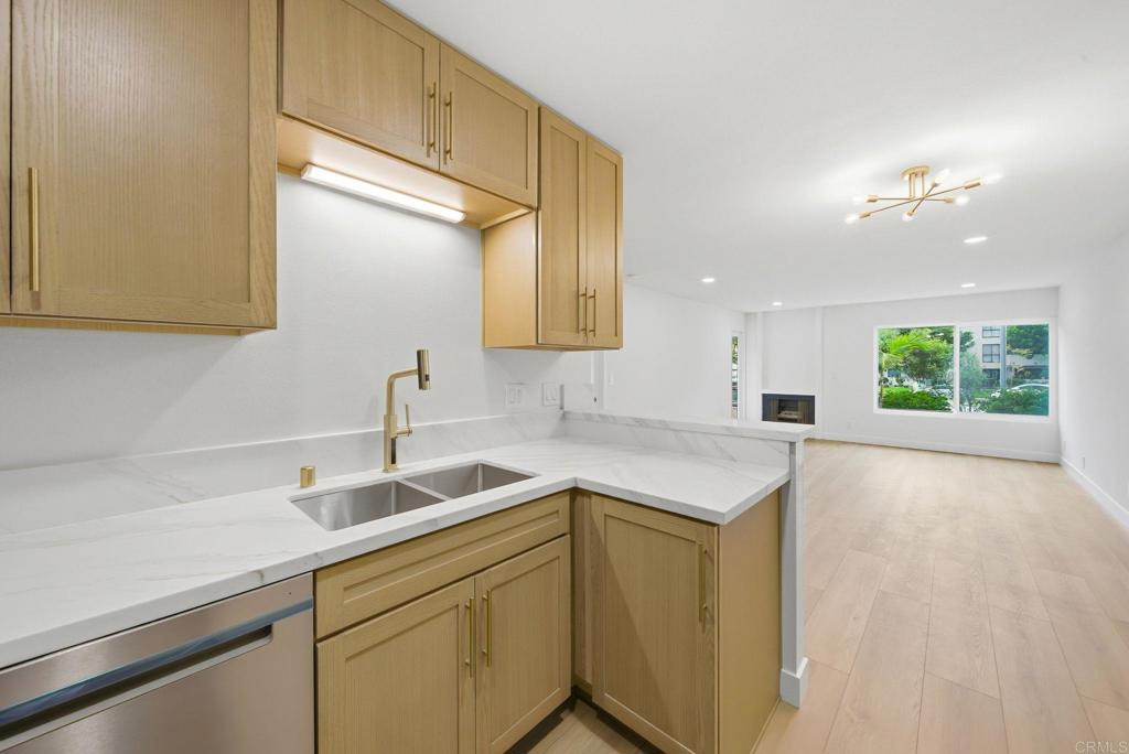 6757 Friars Road, Unit 36 San Diego, CA 92108 - Photo 8 of 23 a kitchen with a sink and cabinets