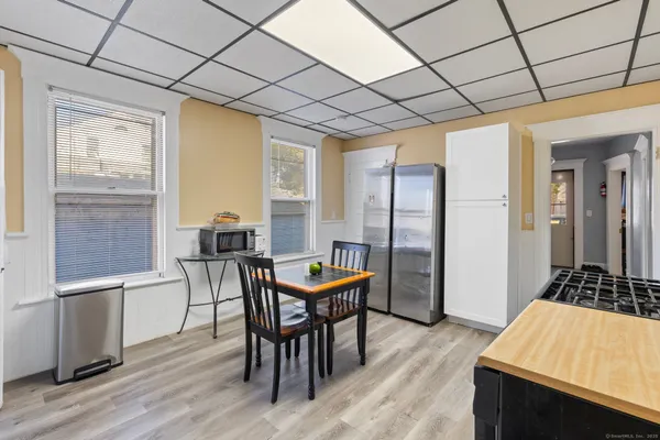a kitchen with stainless steel appliances granite countertop a stove a sink dishwasher and a refrigerator