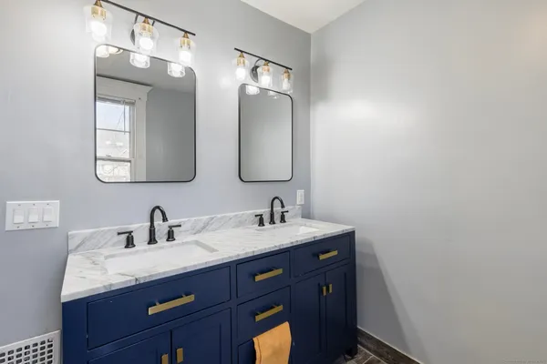 a bathroom with a glass shower door