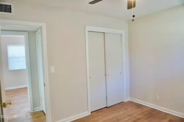 a view of small space with wooden floor