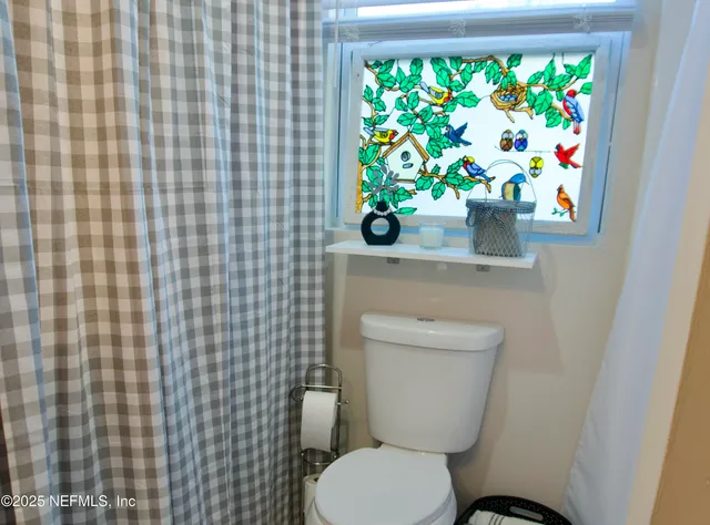 a bathroom with a toilet and a sink