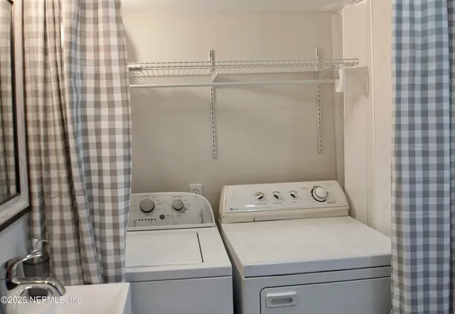 a utility room with dryer and washer