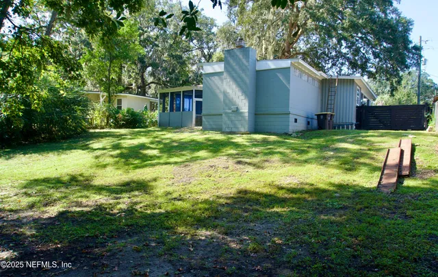 a backyard of a house with seating space