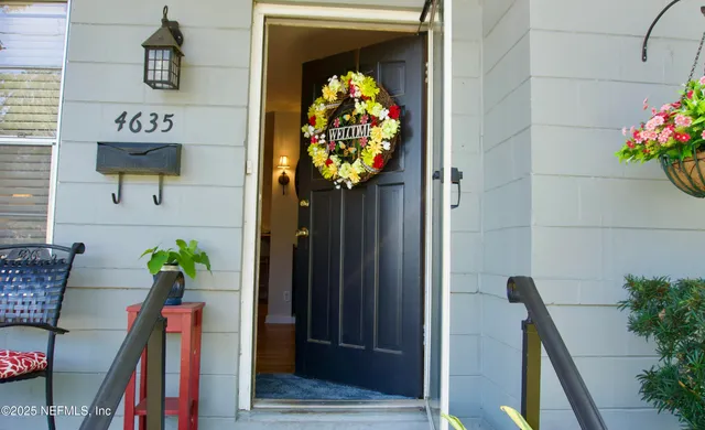 a view of entryway with flower pots