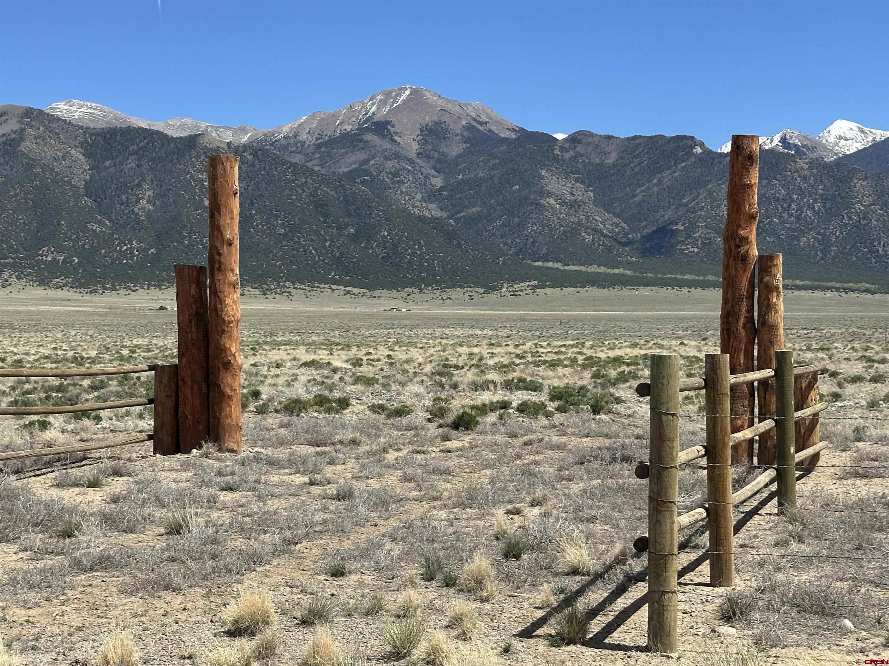 23374 Co Road Moffat, CO 81143 - Photo 2 of 14 a view of a road with an ocean view