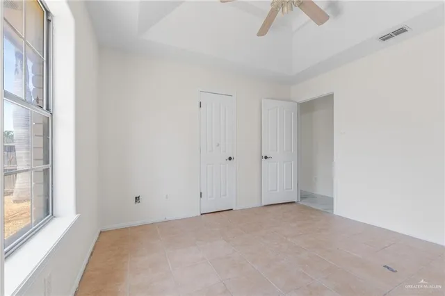 a view of an empty room and a window