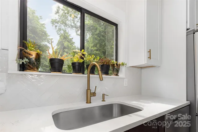 a bathroom with a sink and a window