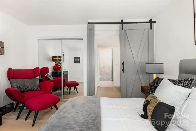 a living room with furniture and a chair