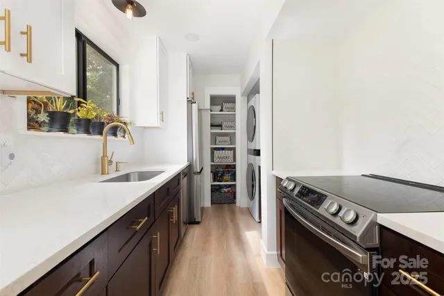 a kitchen with a sink stove and refrigerator