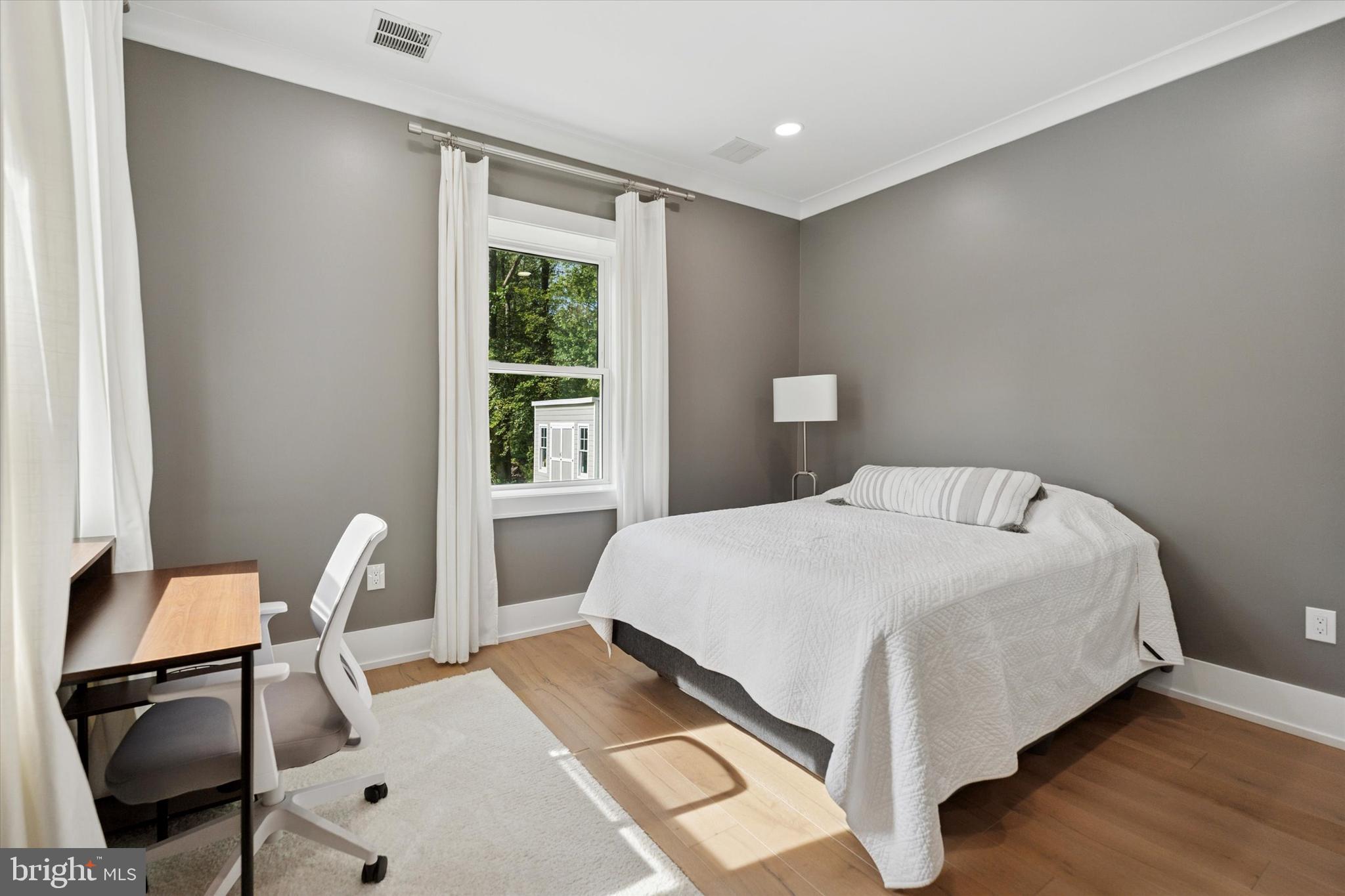 820 Darby Paoli Road Newtown Square, PA 19073 - Photo 13 of 36 a bedroom with a bed a table and chair