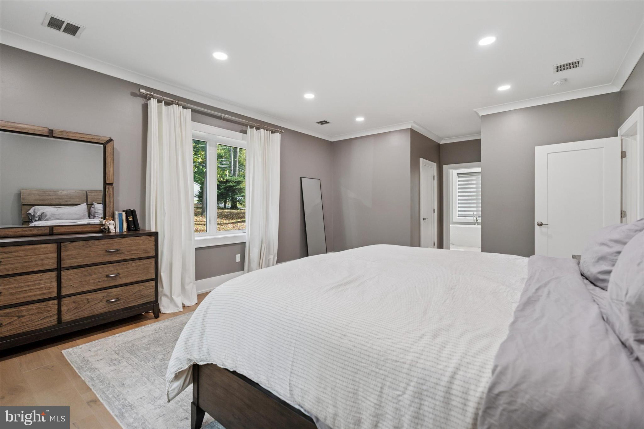 820 Darby Paoli Road Newtown Square, PA 19073 - Photo 15 of 36 a spacious bedroom with a bed and a dresser