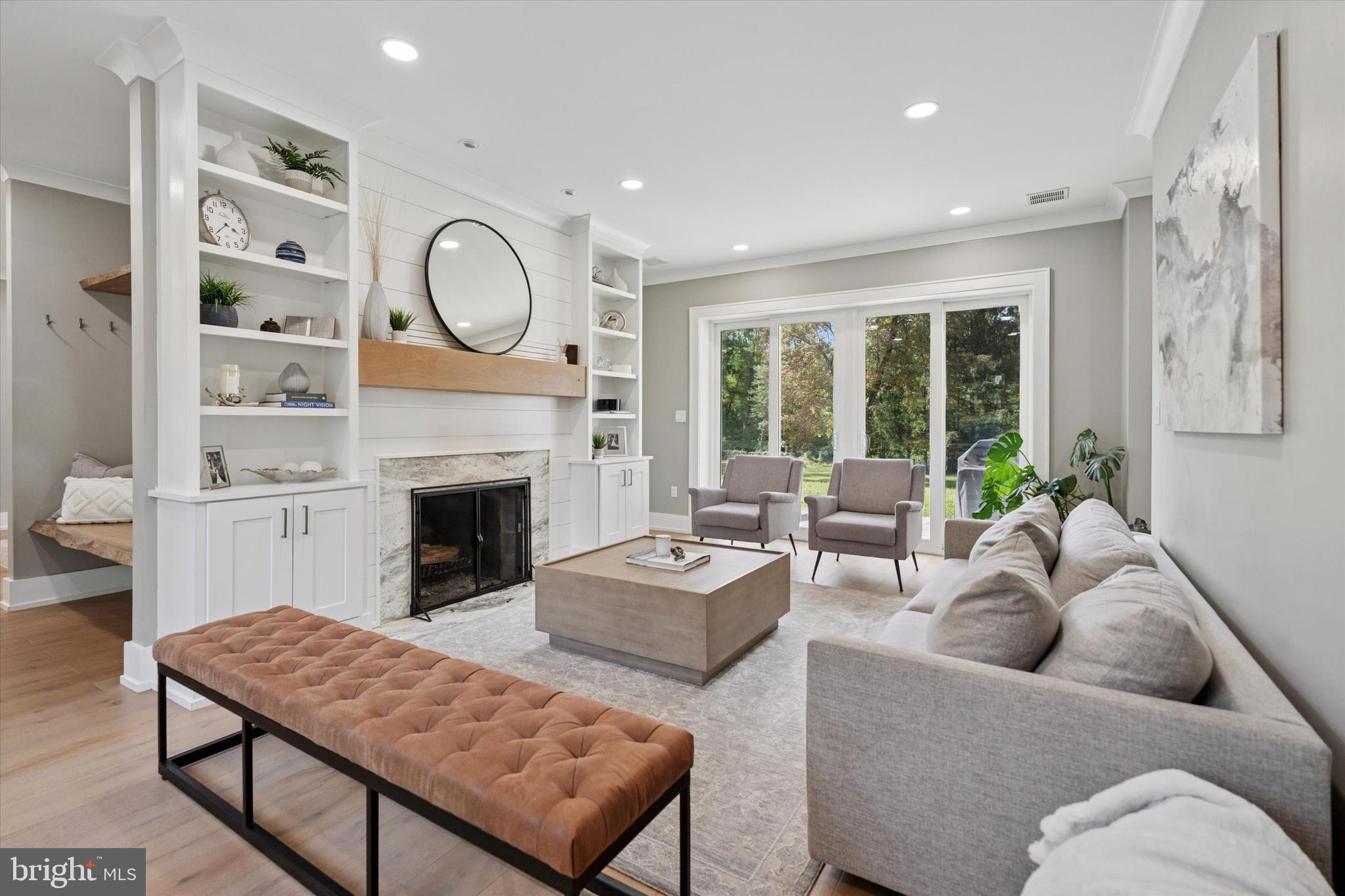 820 Darby Paoli Road Newtown Square, PA 19073 - Photo 3 of 36 a living room with furniture fireplace and a large window