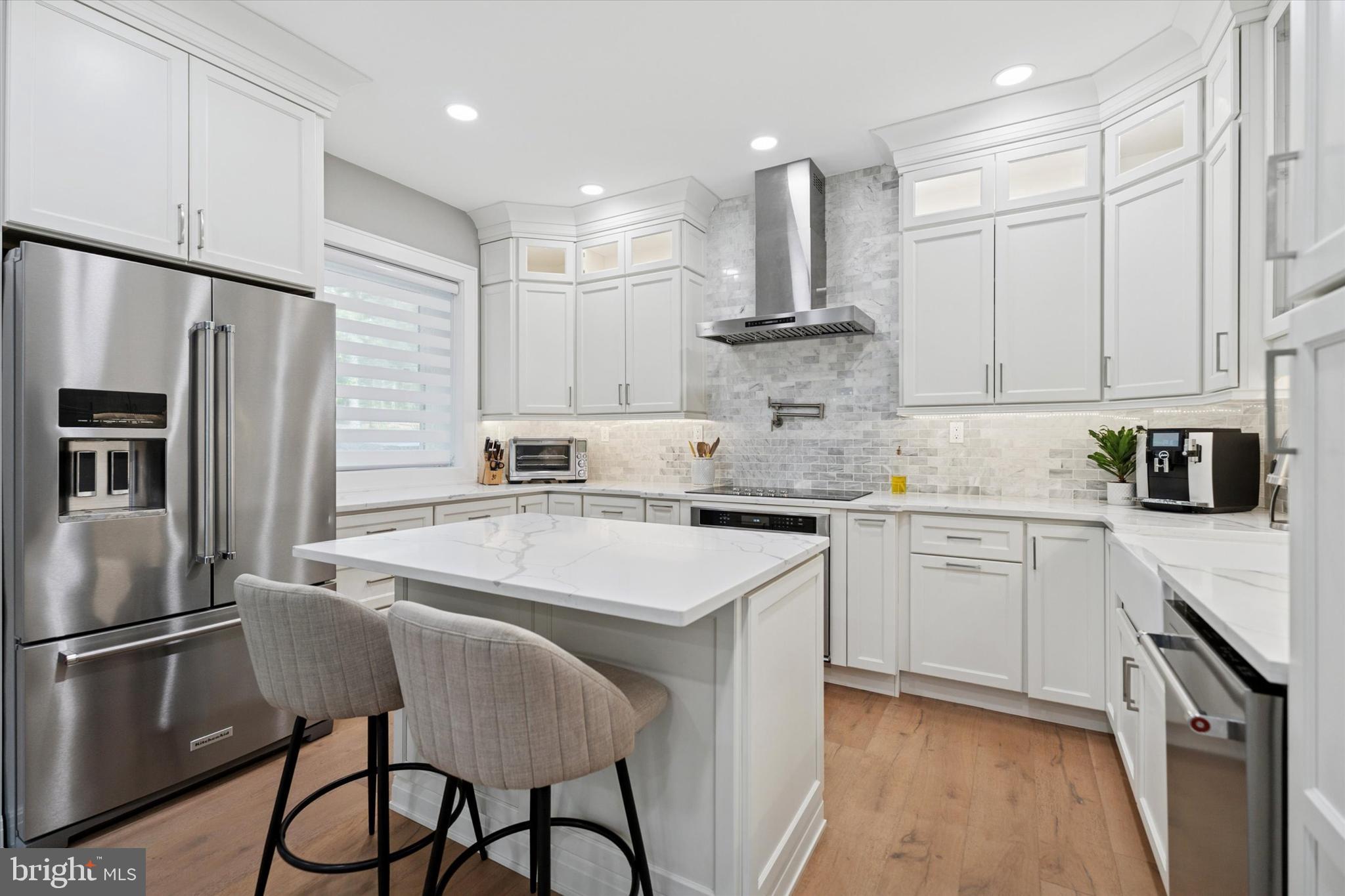 820 Darby Paoli Road Newtown Square, PA 19073 - Photo 10 of 36 a kitchen with a refrigerator a sink and cabinets