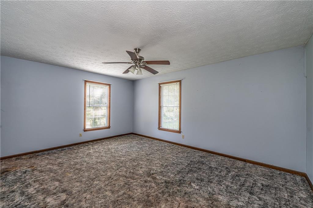 838 Pleasant Hope Road Southeast Silver Creek, GA 30173 - Photo 16 of 30 a view of an empty room and window