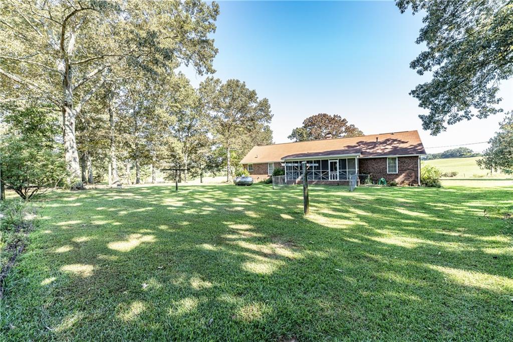 838 Pleasant Hope Road Southeast Silver Creek, GA 30173 - Photo 25 of 30 a front view of a house with a garden