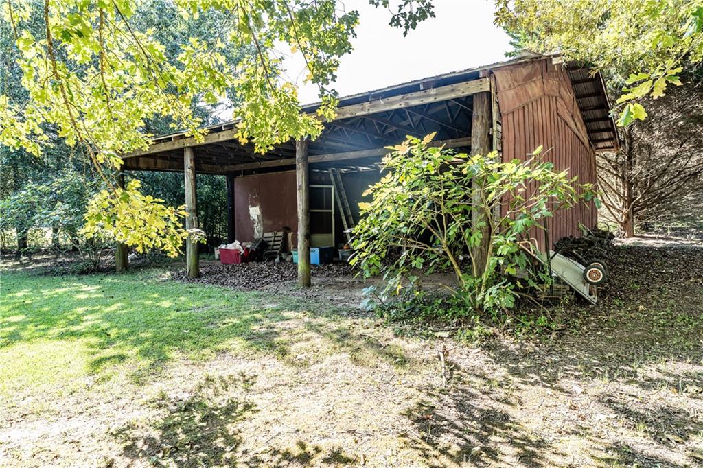 838 Pleasant Hope Road Southeast Silver Creek, GA 30173 - Photo 29 of 30 a backyard of a house with lots of green space