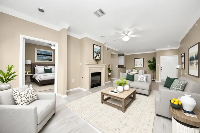 a living room with furniture and a fireplace