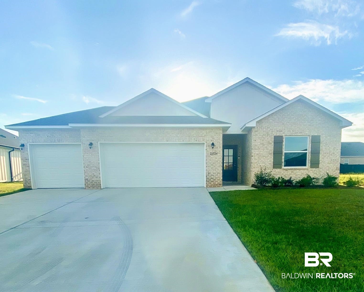 23724 Lafite Circle Daphne, AL 36526 - Photo 1 of 1 Ranch-style home with an attached garage, driveway, brick siding, and a front lawn