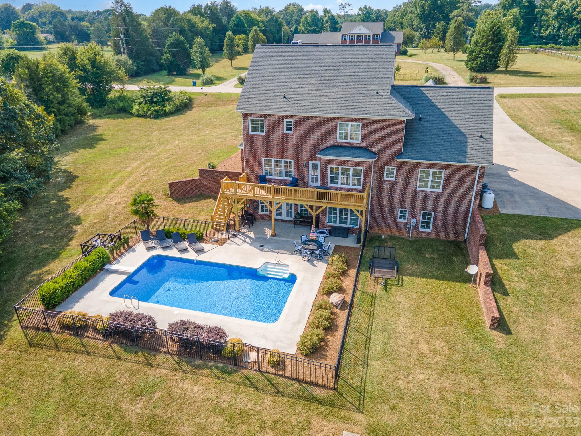 4502 Gold Hill Road Concord, NC 28025 - Photo 3 of 48 an aerial view of a house with swimming pool and ocean view