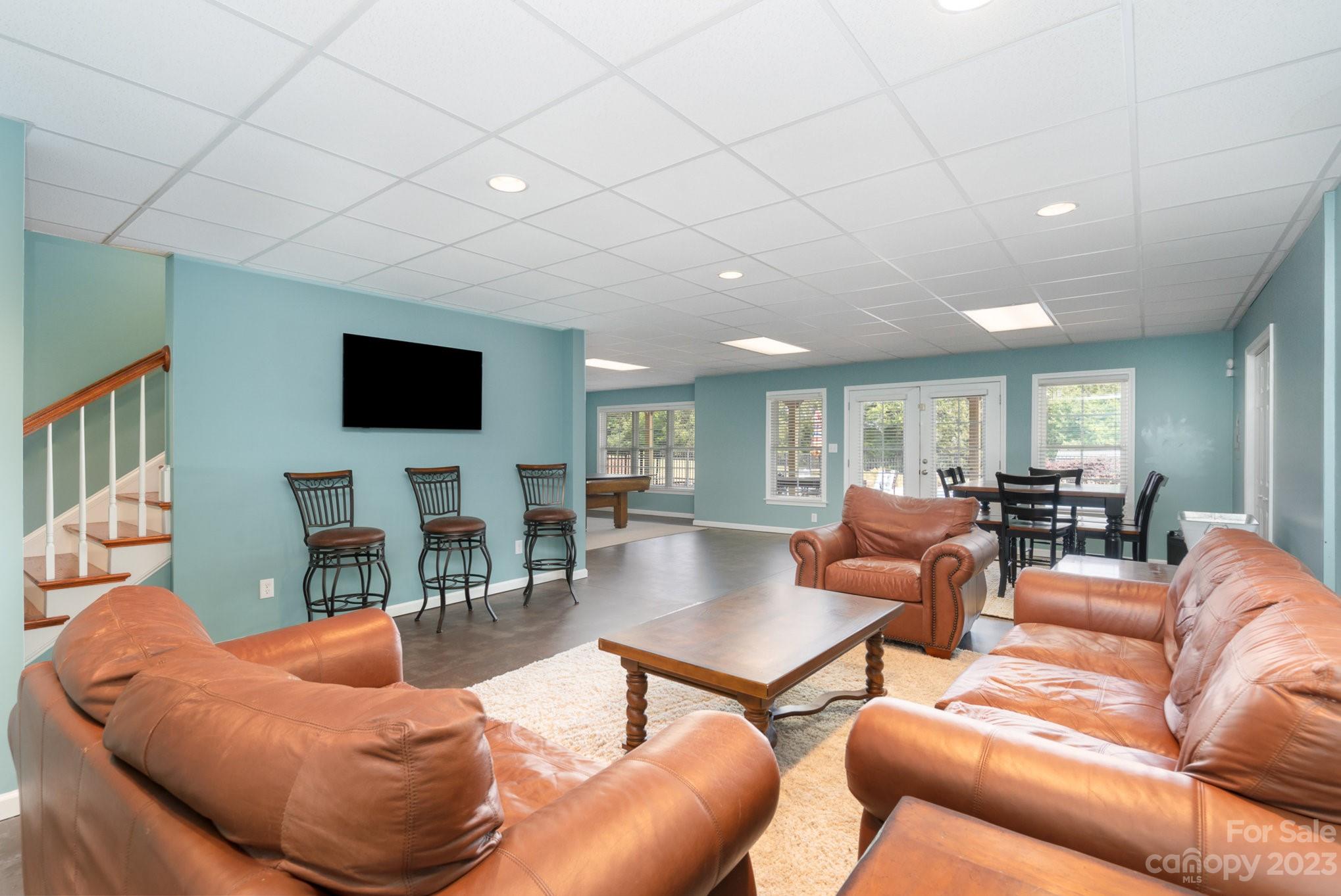 4502 Gold Hill Road Concord, NC 28025 - Photo 33 of 48 a living room with furniture and a flat screen tv