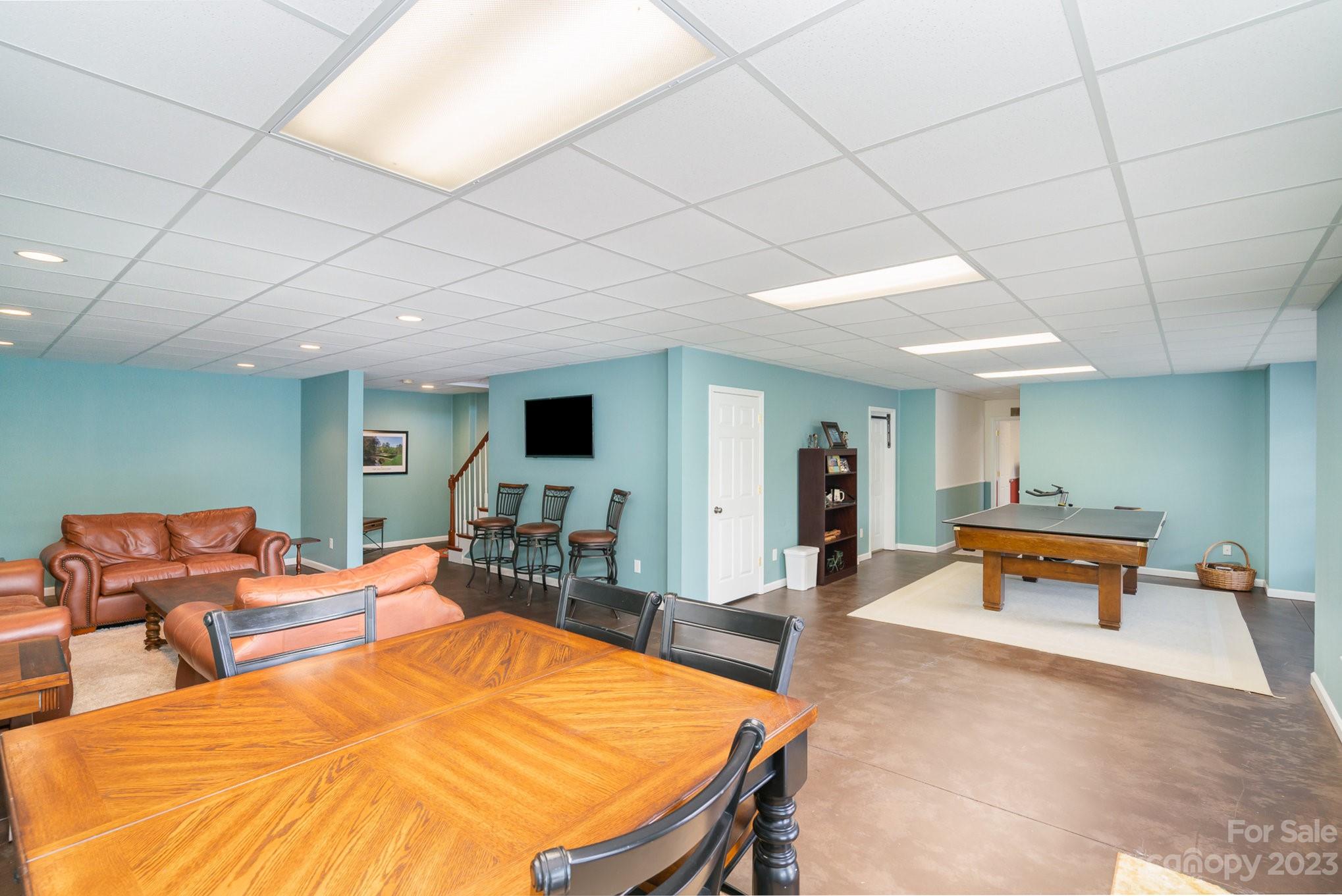 4502 Gold Hill Road Concord, NC 28025 - Photo 41 of 48 a living room with furniture pool table and chairs