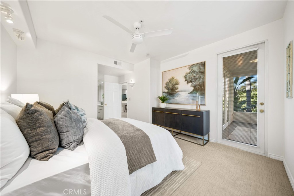 2233 Martin, Unit 204 Irvine, CA 92612 - Photo 21 of 41 a spacious bedroom with a bed and a dresser