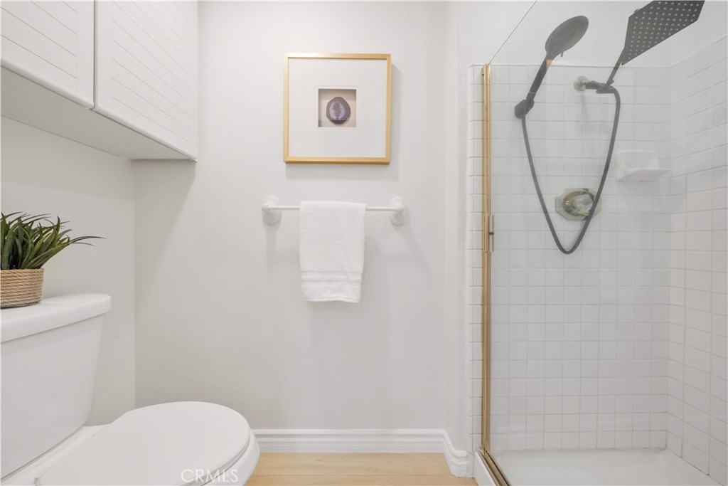 2233 Martin, Unit 204 Irvine, CA 92612 - Photo 25 of 41 a white toilet sitting next to a shower