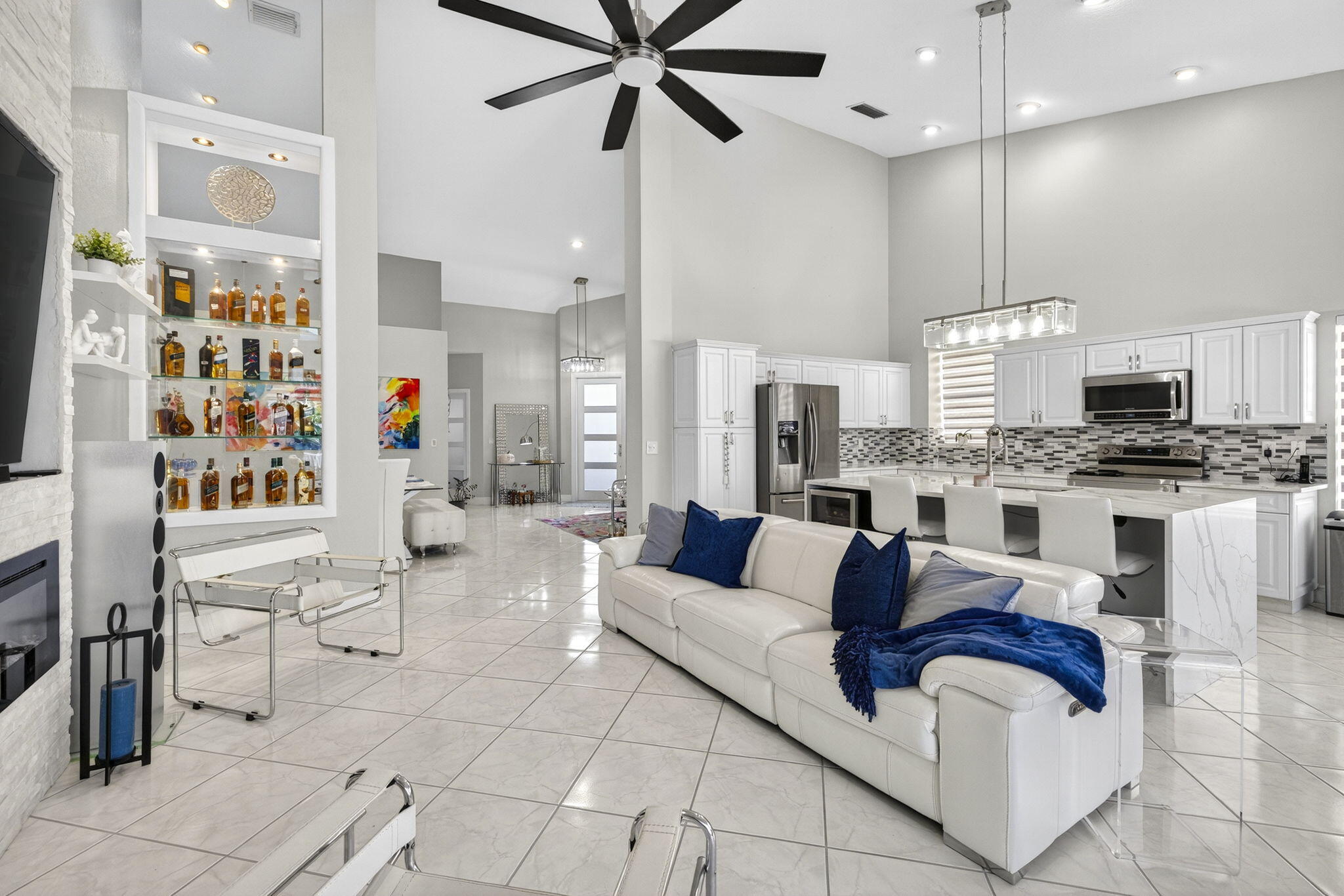 8337 Horseshoe Bay Road Boynton Beach, FL 33472 - Photo 14 of 55 a living room with furniture kitchen view and a chandelier